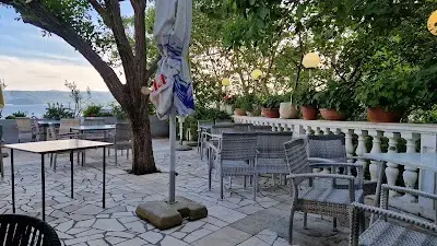 Shaded outdoor terrace at Kod Mije