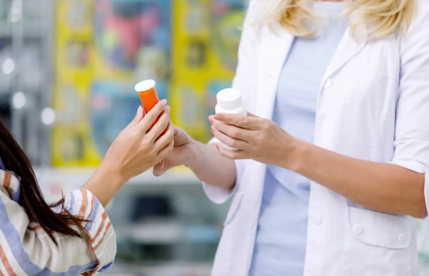 Pharmacist advising a customer